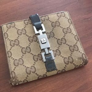 Authentic Gucci Tan/black leather signature wallet